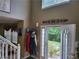 Welcoming foyer with a coat rack and a view of the landscaped backyard, providing a bright entry at 3939 Craggy Perch, Douglasville, GA 30135
