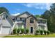 Charming two-story home featuring stone accents, a well-manicured lawn, and an attached two-car garage at 3939 Craggy Perch, Douglasville, GA 30135