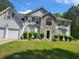Charming two-story home featuring stone accents, a well-manicured lawn, and an attached two-car garage at 3939 Craggy Perch, Douglasville, GA 30135