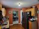 Functional kitchen with light wood cabinets, granite countertops, and access to the dining area at 3939 Craggy Perch, Douglasville, GA 30135