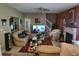 Spacious living room with comfortable seating, a fireplace, and a large television for entertainment at 3939 Craggy Perch, Douglasville, GA 30135