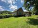Expansive backyard featuring a screened porch perfect for outdoor relaxation and entertaining at 10 Vaughan Ne Ct, Cartersville, GA 30121