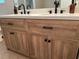 Close-up of the updated bathroom vanity with double sinks, modern faucets, and ample cabinet space at 10 Vaughan Ne Ct, Cartersville, GA 30121