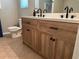 The renovated bathroom features a double vanity, a toilet, and neutral tile flooring at 10 Vaughan Ne Ct, Cartersville, GA 30121
