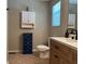 Bathroom showcasing a cabinet above the toilet, a dark-blue storage chest, and an updated vanity at 10 Vaughan Ne Ct, Cartersville, GA 30121
