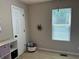 Neutral bedroom featuring bright window, modern storage, and star decor at 10 Vaughan Ne Ct, Cartersville, GA 30121