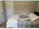Cozy bedroom with a comfortable bed, soft bedding, and a minimalist aesthetic at 10 Vaughan Ne Ct, Cartersville, GA 30121