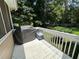 Outdoor deck with grill, storage, and white railing overlooking backyard at 10 Vaughan Ne Ct, Cartersville, GA 30121
