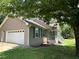 Charming home exterior featuring a garage, and a quaint front porch at 10 Vaughan Ne Ct, Cartersville, GA 30121