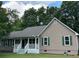 Exterior view of a home with white columns, a covered porch, and green shutters at 10 Vaughan Ne Ct, Cartersville, GA 30121