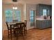 Charming eat-in kitchen with blue cabinets, white counters, and hardwood floors at 10 Vaughan Ne Ct, Cartersville, GA 30121