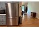 View of the kitchen appliances leading to the living room with hardwood flooring at 10 Vaughan Ne Ct, Cartersville, GA 30121