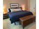 Well-lit bedroom with a wooden chest, soft carpet, and two side tables with lamps at 10 Vaughan Ne Ct, Cartersville, GA 30121
