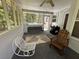 Inviting screened porch featuring swing, rocking chairs, and ceiling fan at 10 Vaughan Ne Ct, Cartersville, GA 30121