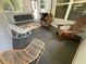 Serene screened porch includes a swing and comfortable rocking chairs at 10 Vaughan Ne Ct, Cartersville, GA 30121
