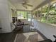Relaxing screened porch with ceiling fan and comfortable rocking chairs at 10 Vaughan Ne Ct, Cartersville, GA 30121