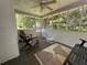 Spacious screened porch with ceiling fan and a variety of seating options at 10 Vaughan Ne Ct, Cartersville, GA 30121