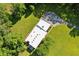 Modern house with a light-colored roof sits on a large lot bordered by mature trees at 110 Bridger Point Rd, Fayetteville, GA 30215