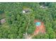 Stunning aerial view of a home and its surroundings, showing its integration with nature at 2100 Mountain Cove Ct, Woodstock, GA 30188