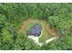 Secluded property surrounded by lush trees and natural beauty, providing privacy and tranquility at 2100 Mountain Cove Ct, Woodstock, GA 30188