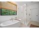 Bright bathroom features a soaking tub, glass shower, and natural light at 2100 Mountain Cove Ct, Woodstock, GA 30188