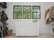 Well-organized closet with white dresser and shelving, offering ample storage space at 2100 Mountain Cove Ct, Woodstock, GA 30188
