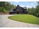 Charming new construction home with a three car garage, front porch and a basketball court at 2100 Mountain Cove Ct, Woodstock, GA 30188