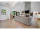 Bright living room with high ceilings, a modern fireplace, and large windows showcasing the outdoor view at 2100 Mountain Cove Ct, Woodstock, GA 30188