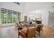 Spacious living room with hardwood floors, stylish furniture, and a seamless flow to the adjacent rooms at 2100 Mountain Cove Ct, Woodstock, GA 30188