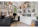 Bright home office features a large desk, black trim windows, and gallery wall at 2100 Mountain Cove Ct, Woodstock, GA 30188