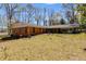 Exterior view of backyard with lawn, patio, and carport at 6339 Cornelia Dr, Douglasville, GA 30134