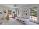 Sunlit ' bedroom with charming decor, featuring three windows and natural light at 6339 Cornelia Dr, Douglasville, GA 30134