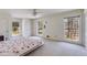 Spacious bedroom featuring three windows offering ample natural light and a ceiling fan at 6339 Cornelia Dr, Douglasville, GA 30134