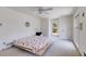 Bright bedroom features carpet, windows, white walls, and ceiling fan at 6339 Cornelia Dr, Douglasville, GA 30134