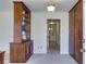 Neutral hallway with decorative light fixture and storage cabinets at 6339 Cornelia Dr, Douglasville, GA 30134