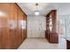 Hallway with built-in storage cabinets with decorative light fixture at 6339 Cornelia Dr, Douglasville, GA 30134