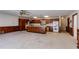 Kitchen with wooden cabinets and island with seating space at 6339 Cornelia Dr, Douglasville, GA 30134