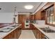 Bright kitchen featuring extensive wood cabinets, a double oven and a functional layout at 6339 Cornelia Dr, Douglasville, GA 30134