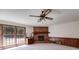 Spacious living area with brick fireplace and large windows for natural light at 6339 Cornelia Dr, Douglasville, GA 30134