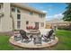Backyard featuring a stone fire pit and patio with outdoor seating at 775 Gran Heritage Way, Dacula, GA 30019