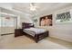 Cozy main bedroom features a ceiling fan and a comfortable king bed at 775 Gran Heritage Way, Dacula, GA 30019