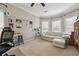 Comfortable bedroom with large windows, soft carpet, and ample space for relaxation or a home office at 775 Gran Heritage Way, Dacula, GA 30019