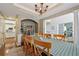 Elegant dining area with hardwood floors, pillars, and view into the foyer, kitchen, and Gathering room at 775 Gran Heritage Way, Dacula, GA 30019