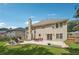 Exterior view of the back of the home with large patio and fire pit area at 775 Gran Heritage Way, Dacula, GA 30019