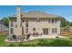 Exterior view of home featuring a large patio and outdoor firepit area at 775 Gran Heritage Way, Dacula, GA 30019