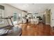 Spacious kitchen features hardwood floors, white cabinets, an island, and stainless steel appliances at 775 Gran Heritage Way, Dacula, GA 30019