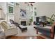 Bright living room with fireplace, large windows, and comfortable seating at 775 Gran Heritage Way, Dacula, GA 30019