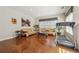 Comfortable living room features hardwood floors, lots of light, neutral decor, and exercise equipment at 775 Gran Heritage Way, Dacula, GA 30019