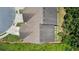Birds eye view of the roof of the townhome with fence and tree lined yard at 173 Oakland Hills Way, Lawrenceville, GA 30044