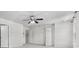 Bedroom with a ceiling fan and two interior doors at 173 Oakland Hills Way, Lawrenceville, GA 30044